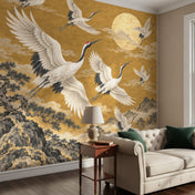 Crane Mural Wallpaper with Golden Mountains, behind a sofa side table